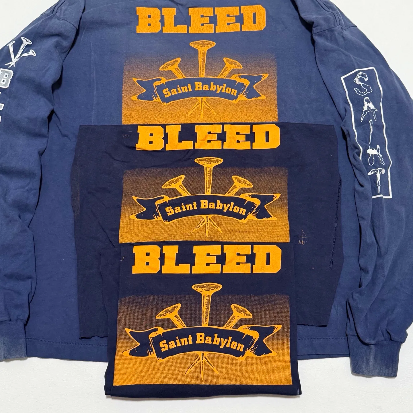 SAINT Mxxxxxx × BABYLON BBLN_LS TEE/SAINT BABYLON/NVY/BABYLON co-branded style Wolf head SAINT/nail distressed long sleeves Washed blue S-XL Completely matched Tube weaving fabric without side seams Garment dyeing Maliu water faded distressing Simulated sun fading treatment Natural fading Handmade holes and frayed Ink splashing treatment Correct main mark/wash mark/little angel anti-counterfeiting mark